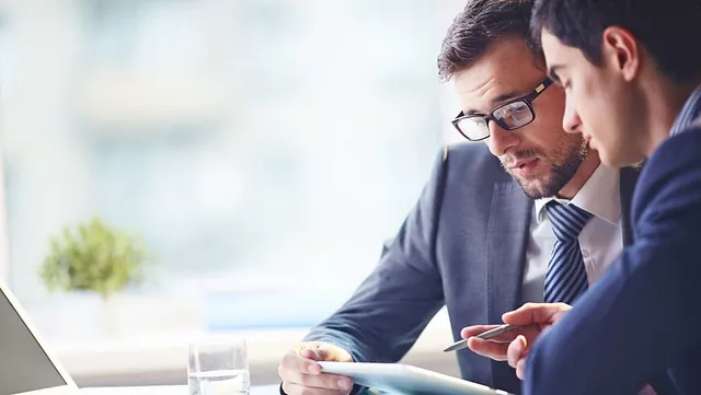 Two accountants working on a account 